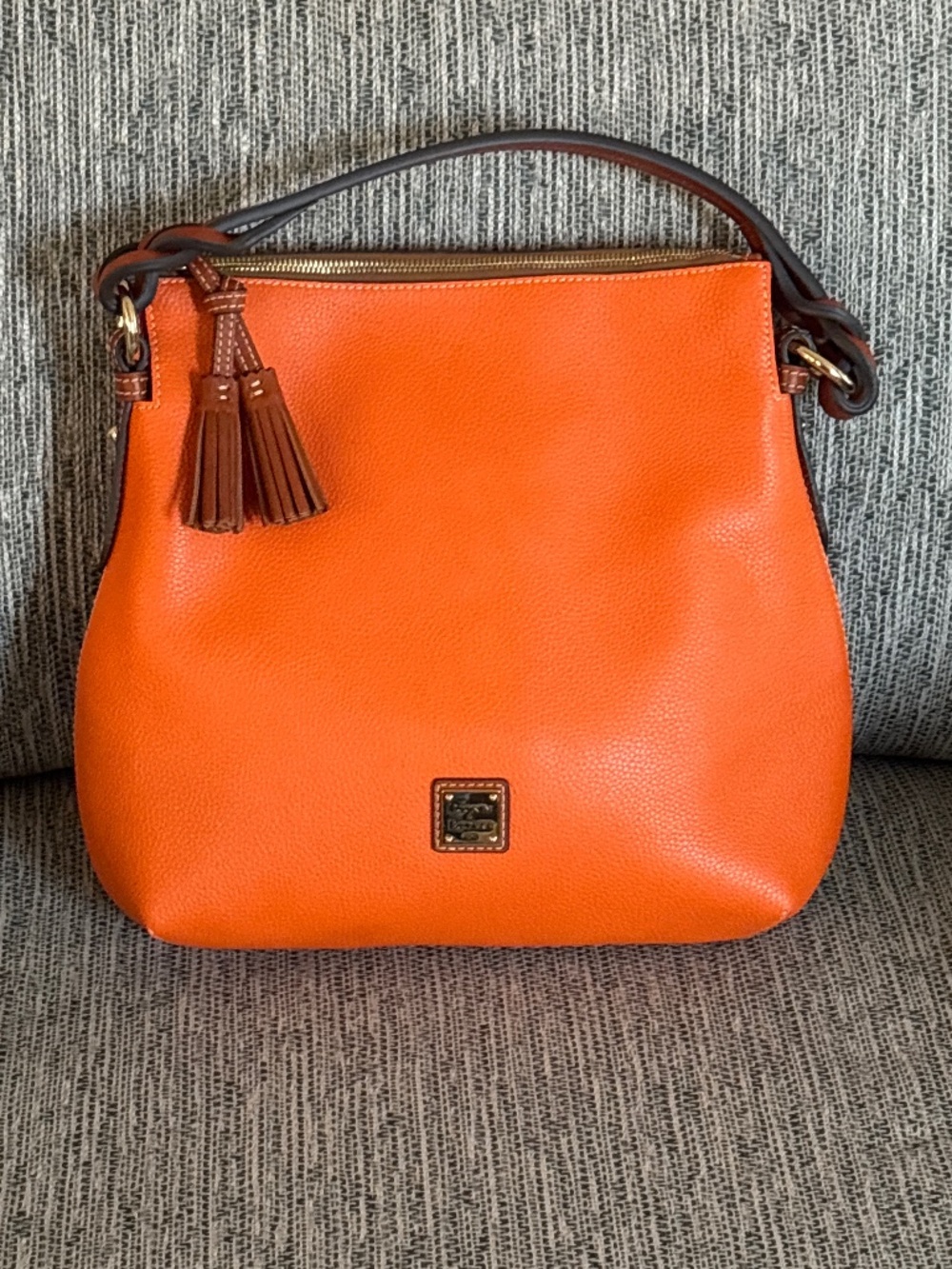 Dooney & Bourke Orange Pebbled Leather Twisted Handle Hobo Handbag